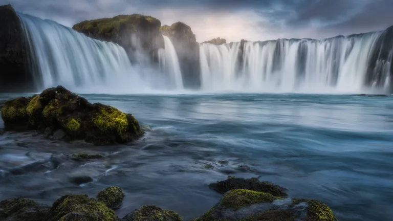 This breathtaking 4K wallpaper captures the beauty of Iceland's Godafoss Waterfall, surrounded by majestic landscapes and serene natural scenery.