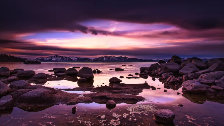 Experience the breathtaking beauty of Lake Tahoe's landscape scenery in stunning 4K resolution. This wallpaper captures the natural wonders of the outdoors, featuring mountain ranges and crystal clear blue water, perfect for nature lovers and travel enthusiasts.