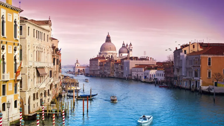 This stunning 4K wallpaper captures the beautiful cityscape of Venice, Italy. The scenery showcases the picturesque buildings and waterways that make this city a popular tourist destination.