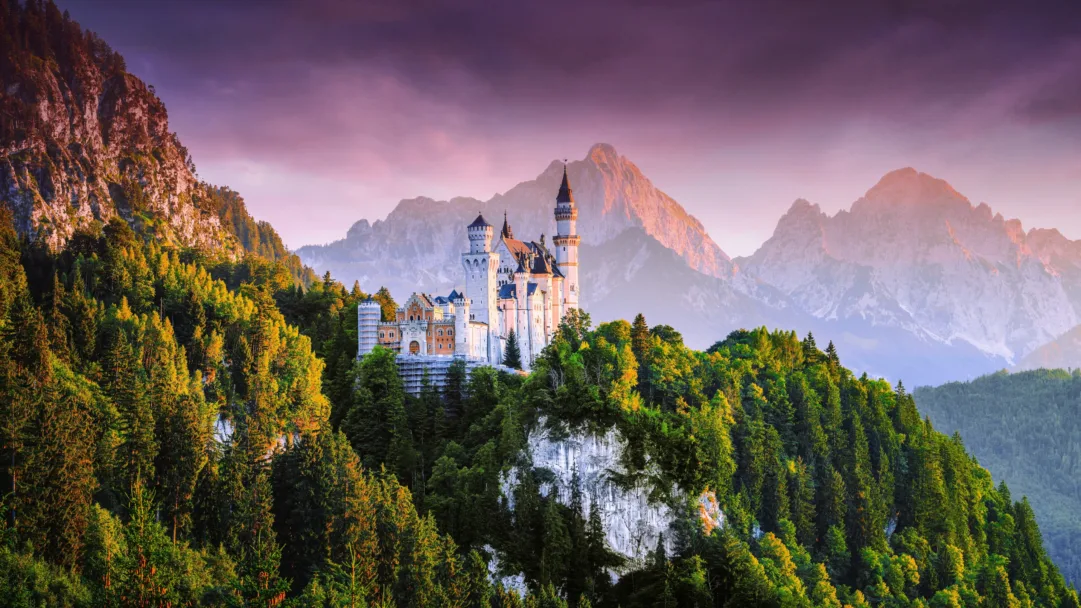 Immerse yourself in the majestic beauty of the Neuschwanstein Castle with this stunning 4K wallpaper. This picturesque wallpaper captures the idyllic Bavarian mountain range and the spectacular European castle, making it an ideal choice for nature and travel enthusiasts who love panoramic views.