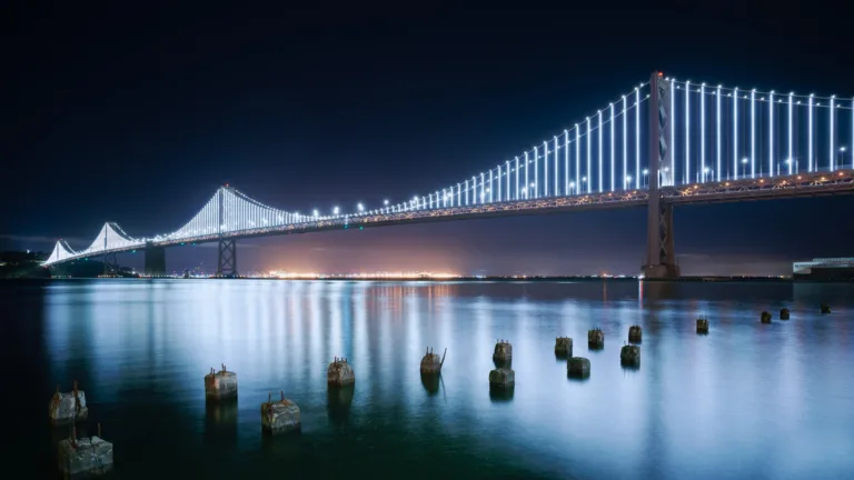 This breathtaking wallpaper showcases the iconic San Francisco-Oakland Bay Bridge against a stunning urban cityscape.