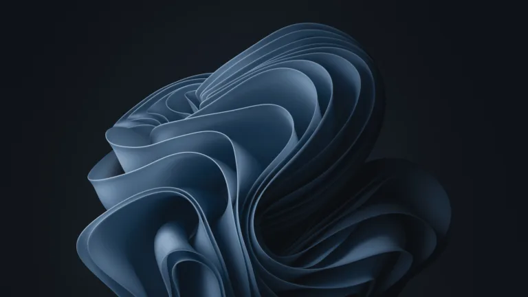 A stunning abstract grey bloom wallpaper for Windows 11 in mesmerizing 4k resolution. Enhance your desktop with this captivating and modern design.