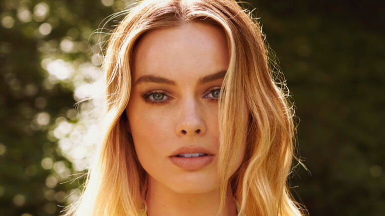 An enchanting 4K wallpaper capturing the beauty of Margot Robbie, a talented actress and Hollywood celebrity, making it a must-have for fans and admirers of her work and charm.