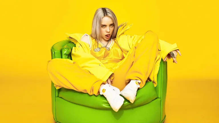 A captivating 4K wallpaper featuring Billie Eilish, the talented music artist and pop sensation known for her unique style and captivating voice, making it an ideal choice for fans and enthusiasts of her music and artistry.