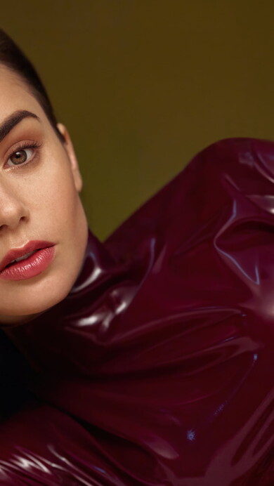 A captivating 4K wallpaper showcasing Lily Collins in a Vogue photoshoot, highlighting the actress's elegance and fashion sense, perfect for fans and admirers of her talent and style.