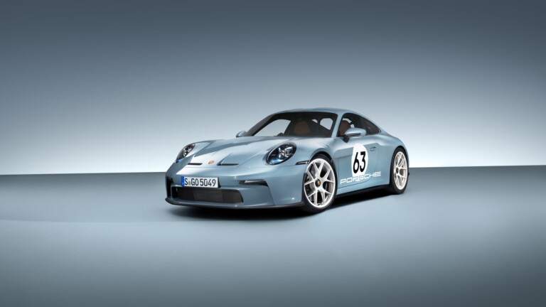 A high-resolution 4K wallpaper featuring the iconic Porsche 911 ST, a classic sports car known for its timeless design and performance, rendered in black and white for a touch of elegance.