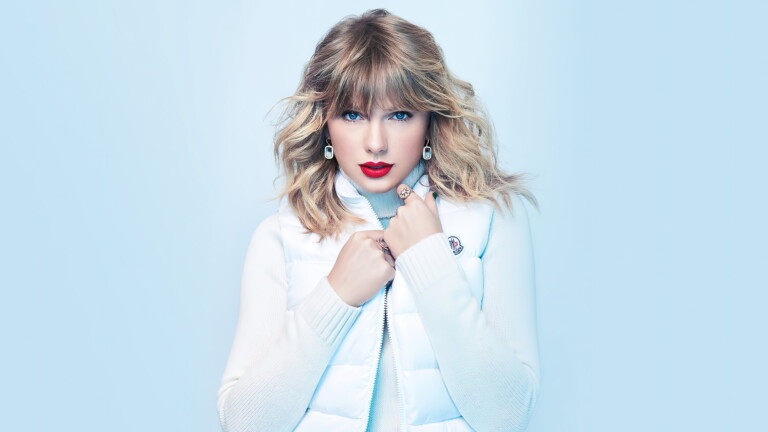 A high-quality 4K wallpaper capturing the essence of Taylor Swift, a celebrated singer-songwriter and music icon, ideal for fans of her music and captivating celebrity presence.