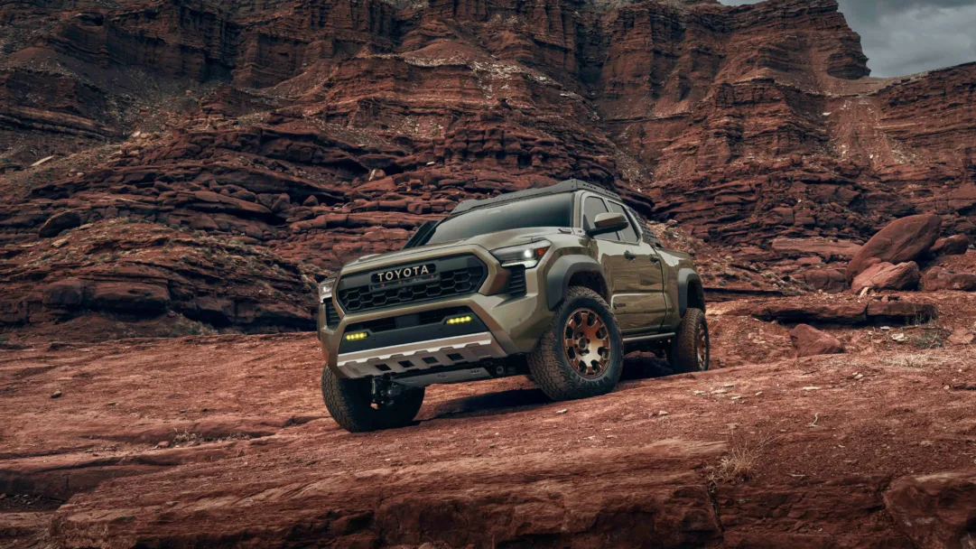 A high-resolution 4K wallpaper featuring the Toyota Tacoma Trailhunter, a capable pickup truck designed for off-road adventures, showcasing its rugged and adventurous spirit.