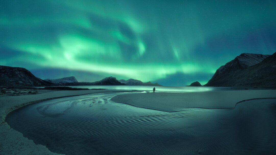 Witness the breathtaking beauty of the Aurora Borealis in stunning 4K resolution. These colorful lights dance across the celestial night sky, creating a serene and awe-inspiring natural phenomenon. Ideal for those who appreciate the wonders of the universe and a captivating view as a desktop background.