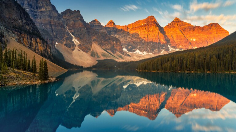 Immerse yourself in the natural beauty of Banff National Park in Canada with this stunning 4K wallpaper. The rugged wilderness of the Rocky Mountains and the serene landscape create a captivating scene that embodies the park's natural wonder. Ideal for travelers and those seeking a desktop background that captures the majestic beauty of North America's wilderness.
