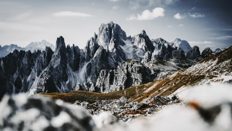 Immerse yourself in the serene beauty of the Cadini di Misurina Mountains in Italy's Dolomites with this mesmerizing 4K wallpaper. The alpine beauty and rugged landscape of South Tyrol create a tranquil and scenic escape. Perfect for travelers and those seeking a desktop background that captures the natural wonder and serenity of these majestic mountains.