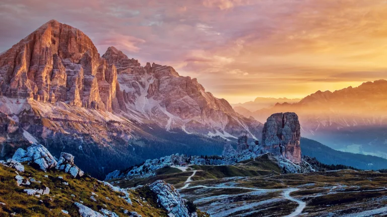Immerse yourself in the breathtaking beauty of the Cinque Torri Mountains in Italy's Dolomites with this captivating 4K wallpaper. The alpine beauty and rugged landscape create a tranquil and scenic escape. Perfect for travelers and those seeking a desktop background that captures the natural wonder and serenity of this iconic mountain range.