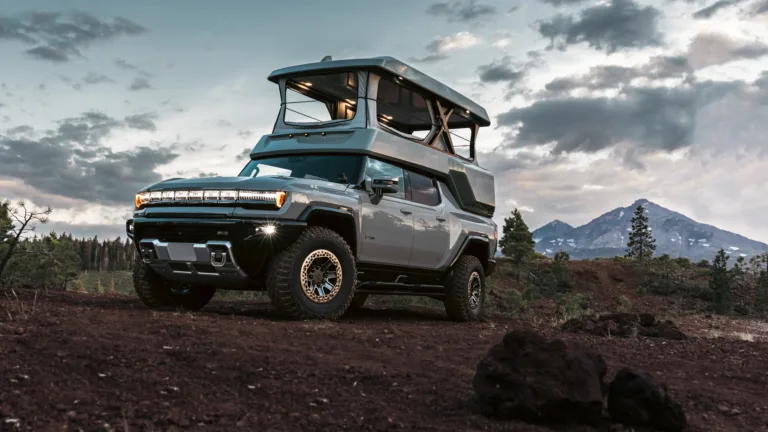 An impressive 4K wallpaper featuring the 2024 GMC Hummer EV EarthCruiser, a remarkable electric vehicle designed for off-road adventures. Perfect for showcasing the rugged luxury of this pickup truck on your desktop or mobile screen.