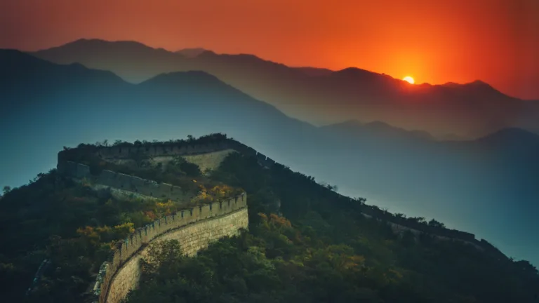 Experience the awe-inspiring beauty of the Great Wall of China at sunset with this stunning 4K wallpaper. This iconic historical landmark boasts ancient architecture and offers a majestic view that's perfect for travelers and those seeking a captivating desktop background that captures the grandeur of this world wonder.