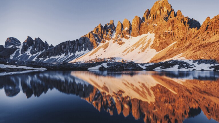 Immerse yourself in the serene beauty of Lago di Piano in Italy with this captivating 4K wallpaper. The alpine lake, surrounded by the stunning landscape of Lombardy, offers a tranquil and scenic escape. Perfect for travelers and those seeking a desktop background that captures the natural tranquility and alpine wonder of this Italian gem.