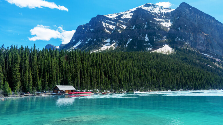 Immerse yourself in the serene beauty of Lake Louise in Canada's Banff National Park with this stunning 4K wallpaper. The turquoise waters, surrounded by the majestic Rocky Mountains, create a breathtaking scene that exudes tranquility. Ideal for travelers and those seeking a desktop background that captures the natural wonder and serene beauty of this iconic lake.