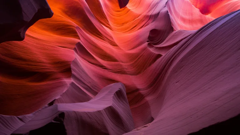 Immerse yourself in the stunning beauty of Lower Antelope Canyon in Arizona, USA, with this mesmerizing 4K wallpaper. The intricate sandstone formations and the play of light create a captivating and scenic desert landscape. Perfect for travelers and those seeking a desktop background that captures the natural wonder and geological beauty of this iconic slot canyon in the Southwest.
