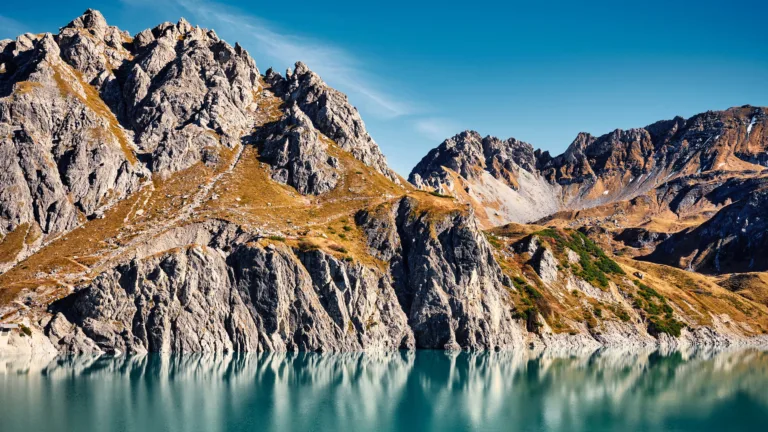 Immerse yourself in the serene beauty of Lünersee Lake in the Austrian Alps with this captivating 4K wallpaper. Nestled in the Alpine landscape, this mountain lake offers a tranquil and scenic escape. Perfect for travelers and those seeking a desktop background that captures the natural tranquility and alpine wonder of Austria.