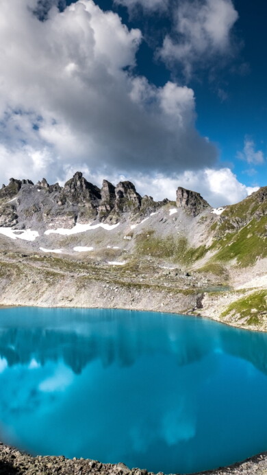 Embark on a visual journey through the stunning Pizol Five Lake Hike in the Swiss Alps with this captivating 4K wallpaper. These pristine mountain lakes, nestled in the alpine landscape of Switzerland, offer a serene and tranquil escape. Perfect for travelers and those seeking a desktop background that embodies natural beauty, serenity, and alpine wonder.