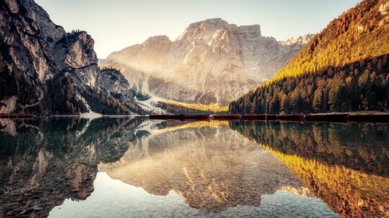 Immerse yourself in the serene beauty of Pragser Wildsee Lake in Italy's South Tyrol region with this captivating 4K wallpaper. The alpine lake, surrounded by the stunning landscape of South Tyrol, offers a tranquil and scenic escape. Perfect for travelers and those seeking a desktop background that captures the natural tranquility and alpine wonder of this Italian gem.