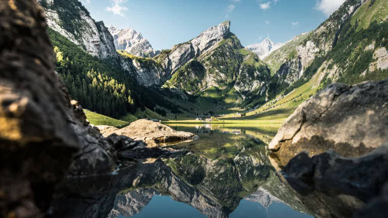 Immerse yourself in the serene beauty of Seealpsee Lake in the Appenzell Alps of Switzerland with this captivating 4K wallpaper. The alpine lake, nestled amidst the stunning Swiss landscape, offers a tranquil and scenic escape. Perfect for travelers and those seeking a desktop background that captures the natural tranquility and alpine wonder of this Swiss gem.