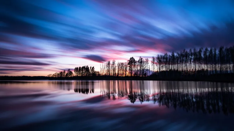 Experience the serene beauty of a 4K sunset wallpaper, capturing the breathtaking colors of the evening sky as the day transitions into twilight. Ideal for those who appreciate the beauty of nature and a calming scenic view as a desktop background.