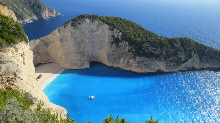 Immerse yourself in the breathtaking beauty of Zakynthos Island in Greece with this captivating 4K wallpaper. The stunning coastline and crystal-clear turquoise waters of the Ionian Sea create a scenic paradise that's perfect for travelers and those seeking a desktop background that captures the natural wonder of this Greek gem.