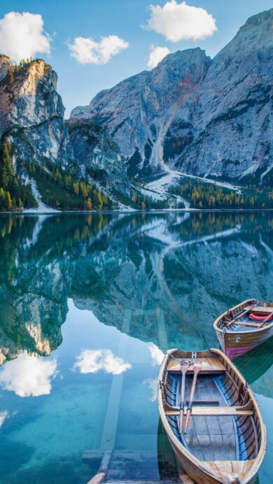 Immerse yourself in the natural beauty of Italy with this breathtaking 4K wallpaper featuring Lago Di Braies. The serene lake nestled in the Dolomites of the Alps is a perfect choice for your high-resolution desktop background.
