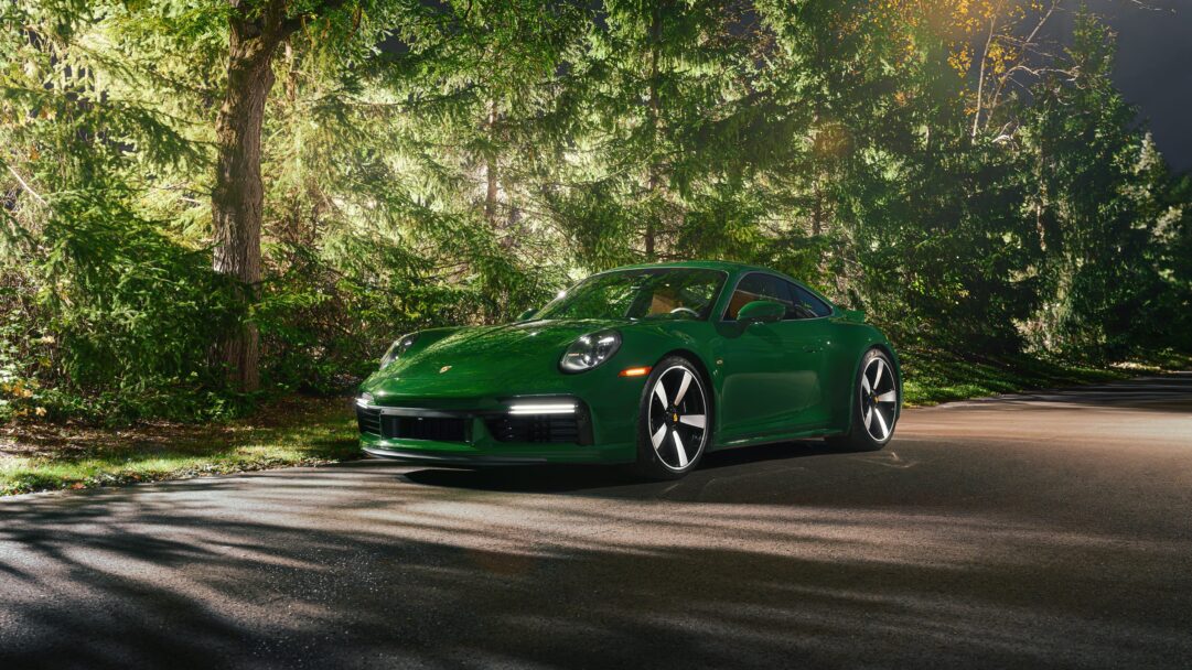 A high-resolution 4K wallpaper featuring the iconic Porsche 911 Sport Classic. This luxury sports car is a masterpiece of automotive design, ready to enhance your desktop or device background.