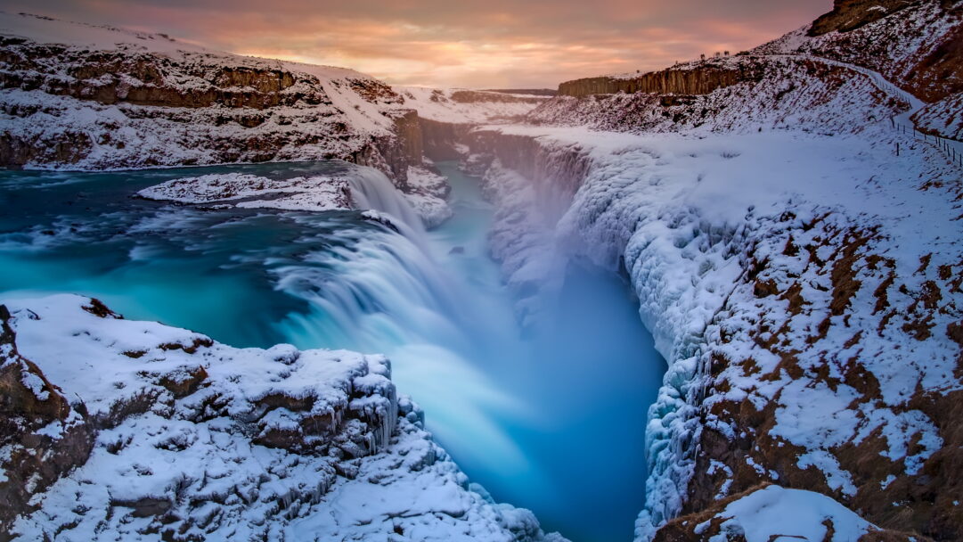 Immerse yourself in the natural wonder of Iceland with this breathtaking 4K wallpaper featuring a mesmerizing waterfall. It's the perfect choice for your high-resolution desktop background, capturing the scenic beauty of this Nordic island.