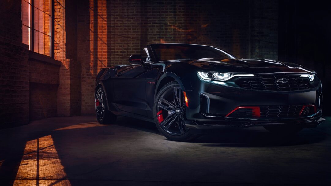 A striking 4K wallpaper showcasing the sleek Chevrolet Camaro 2024 sports car. Experience the high-resolution detail of this iconic American muscle car, perfect for adorning your desktop or mobile background with a vision of automotive excellence and high-speed performance.