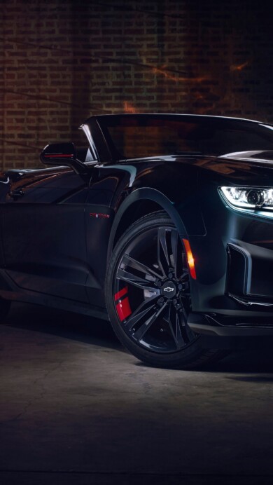 A striking 4K wallpaper showcasing the sleek Chevrolet Camaro 2024 sports car. Experience the high-resolution detail of this iconic American muscle car, perfect for adorning your desktop or mobile background with a vision of automotive excellence and high-speed performance.