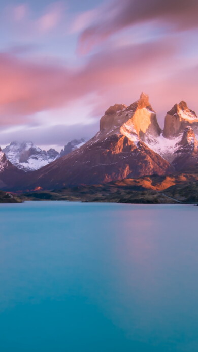 Immerse yourself in the breathtaking beauty of Lake Pehoe in Torres del Paine National Park, Chile, through this 4K wallpaper. Featuring the pristine blue waters against the backdrop of the majestic peaks, it showcases the serene charm of this remarkable location, ideal for high-resolution displays.