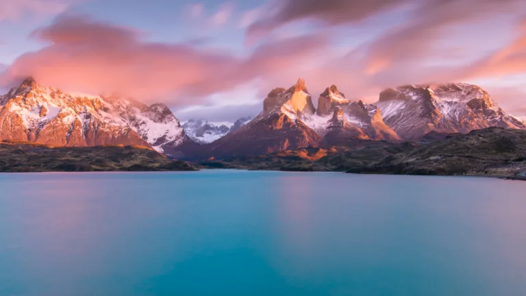 Immerse yourself in the breathtaking beauty of Lake Pehoe in Torres del Paine National Park, Chile, through this 4K wallpaper. Featuring the pristine blue waters against the backdrop of the majestic peaks, it showcases the serene charm of this remarkable location, ideal for high-resolution displays.