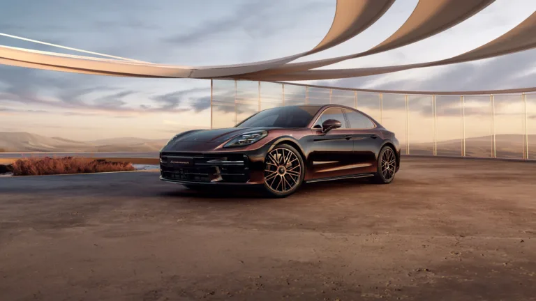 A sleek and powerful 4K wallpaper showcasing the Porsche Panamera Turbo E-Hybrid Sonderwunsch. This high-resolution image captures the dynamic elegance of the luxury sports car, making it an ideal choice for enthusiasts looking to enhance their desktop or mobile display with the sophistication and performance of Porsche engineering.