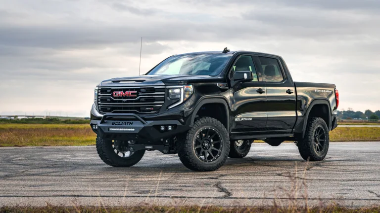 A striking 4K wallpaper featuring the powerful GMC Sierra, a robust and rugged American pickup truck. The high-resolution image showcases the truck's impressive design, making it an ideal choice for enthusiasts to adorn their desktop or mobile screens with the essence of automotive excellence.