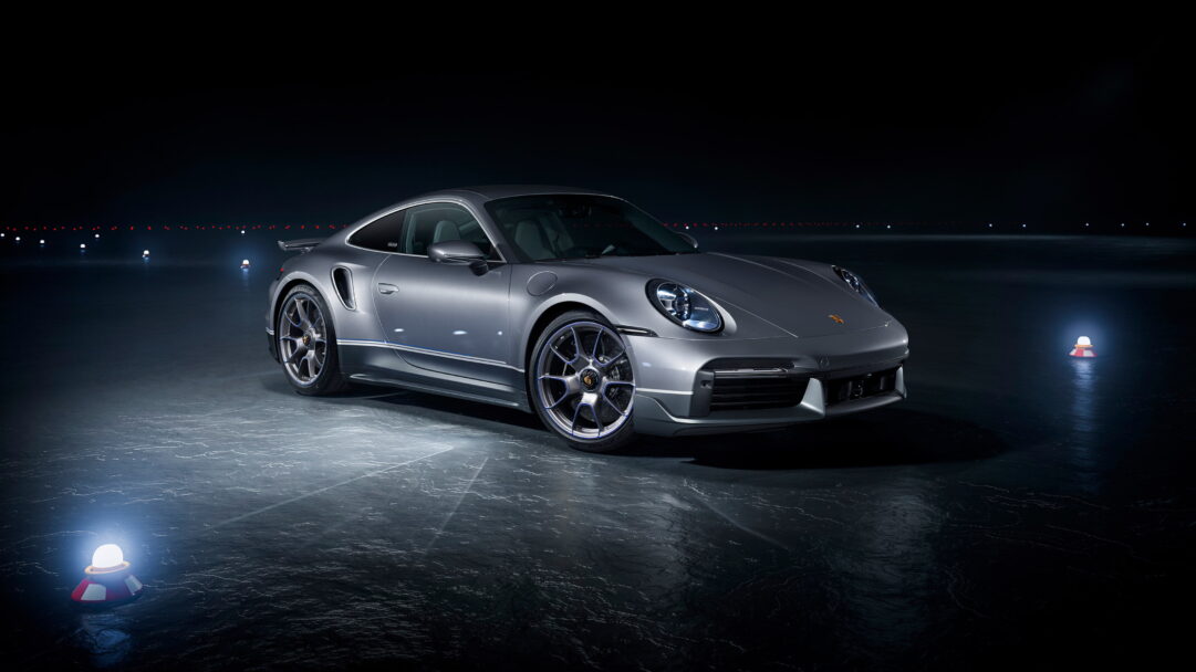 A stunning 4K wallpaper featuring the Porsche 911 Turbo S, a pinnacle of luxury and high performance. The sleek design and powerful presence of this sports car are beautifully captured, making it an ideal choice for your desktop or mobile wallpaper.