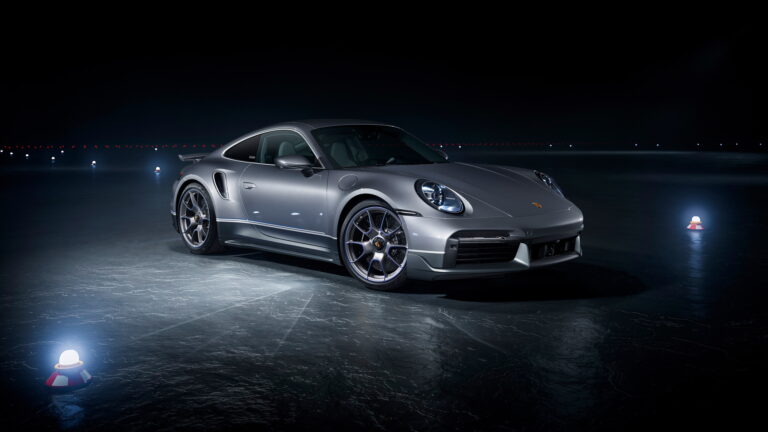 A stunning 4K wallpaper featuring the Porsche 911 Turbo S, a pinnacle of luxury and high performance. The sleek design and powerful presence of this sports car are beautifully captured, making it an ideal choice for your desktop or mobile wallpaper.