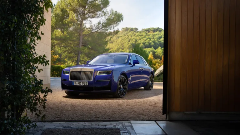 A luxurious 4K wallpaper featuring the Rolls-Royce Ghost, showcasing its sleek design and elegant presence. The high-resolution image captures the essence of this premium luxury car, making it an ideal choice for your desktop or mobile wallpaper.