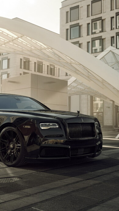 A sophisticated 4K wallpaper featuring the Spofec Rolls-Royce Wraith Black Badge Overdose, a pinnacle of luxury and sleek automotive design. The high-resolution image captures the essence of this exotic masterpiece, making it a perfect choice for your desktop or mobile background.