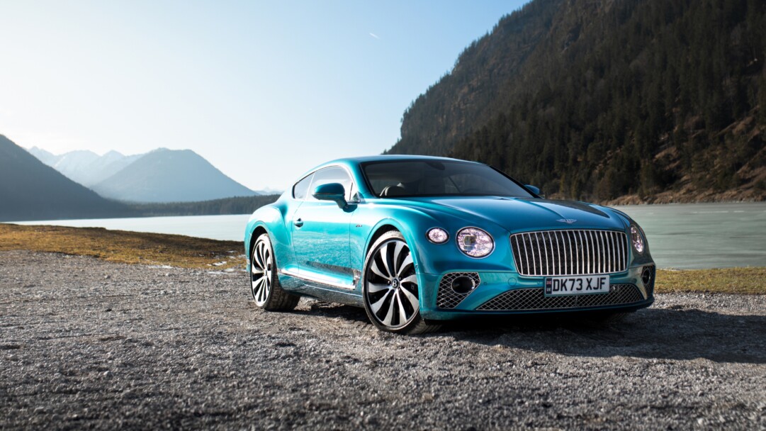 A sophisticated 4K wallpaper featuring the 2024 Bentley Continental GT Mulliner, showcasing its luxurious design in high resolution. The sleek lines and elegant details of this high-end automobile make it an ideal choice for your desktop or mobile background.