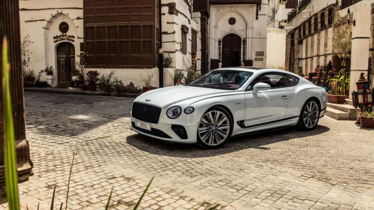 A luxurious Bentley Continental GT graces this stunning 4K wallpaper, showcasing its sleek design and powerful presence. The high-resolution image captures the essence of automotive elegance, making it an ideal choice for adorning your desktop or mobile screen with a touch of sophistication and speed.