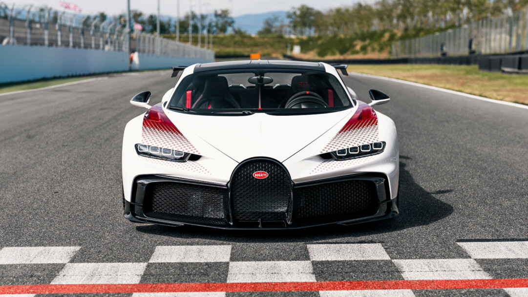 A breathtaking 4K wallpaper featuring the Bugatti Chiron Pur Sport Grand Prix edition, showcasing the epitome of luxury and high performance. The sleek design and powerful presence of this hypercar are captured in exquisite detail, making it an ideal choice for automotive enthusiasts.