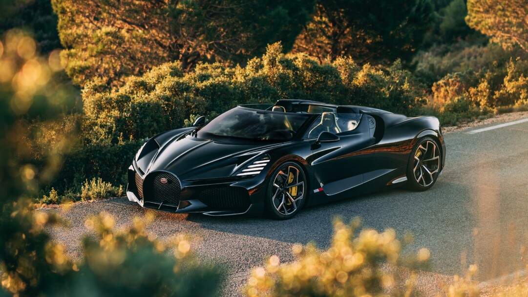 A mesmerizing 4K wallpaper featuring the Bugatti W16 Mistral Roadster, a pinnacle of luxury and high performance. The sleek design, powerful engine, and breathtaking details of this supercar are beautifully showcased in this high-resolution wallpaper, perfect for adorning your desktop or mobile screen with automotive elegance.