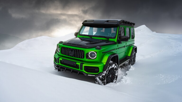 A mesmerizing 4K wallpaper featuring the powerful Mercedes-AMG G63 navigating through a pristine snow-covered landscape. The luxury SUV stands out against the snowy backdrop, exuding elegance and power.