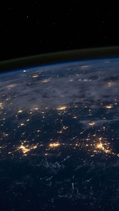 An awe-inspiring 4K PC wallpaper presents a breathtaking view of Earth from outer space, courtesy of NASA.