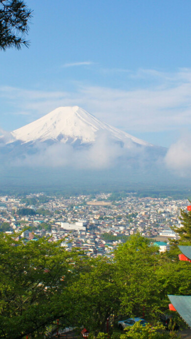 A stunning 4K wallpaper featuring the majestic Mount Fuji with a traditional Japanese pagoda in the foreground. This breathtaking scene captures the serene beauty of Japan's iconic mountain and architecture, making it an ideal backdrop for your desktop or mobile device.
