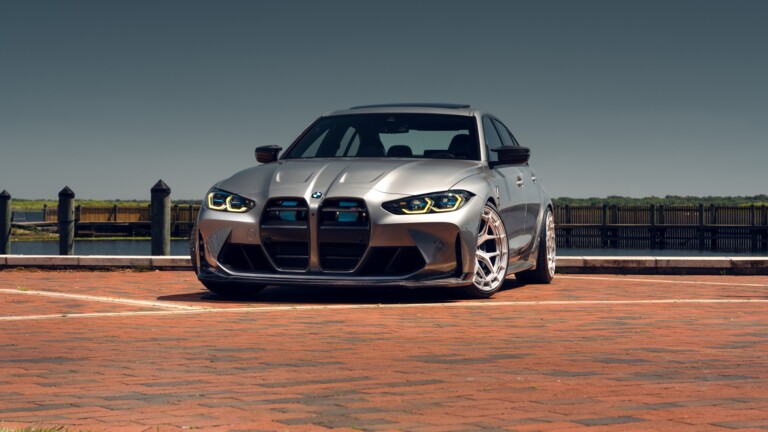 A stunning 4K wallpaper featuring a sleek grey BMW M3. This high-resolution image captures the luxury and performance of the sports car, set against an elegant backdrop, perfect for your desktop or mobile wallpaper.