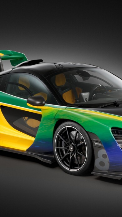 A stunning 4K wallpaper featuring the McLaren Senna, a high-performance sports car, set against a dynamic background. The sleek design and powerful presence of this luxury car are captured in high resolution, perfect for your desktop or mobile wallpaper.