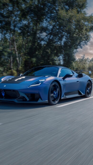 A stunning 4K wallpaper featuring the 2024 Maserati GT2 Stradale. The sleek design and aggressive stance of the car are highlighted, showcasing its luxurious and powerful presence on the road.